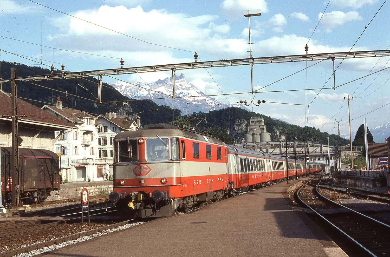 A "Swiss Express" service pulled by Re 4/4 II 11112 electric locomotive